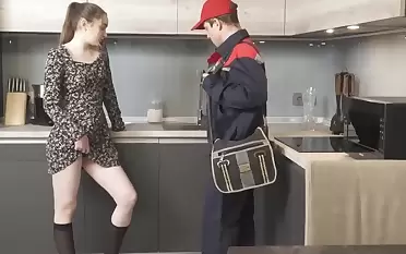 Tainted girl tempts plumber into spontaneous sex near the kitchen